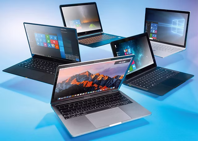 Laptop with keyboard and accessories on clean desk